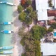 Tropical islands in Indonesia, traditional boats moored on beach, aerial - VideoHive Item for Sale