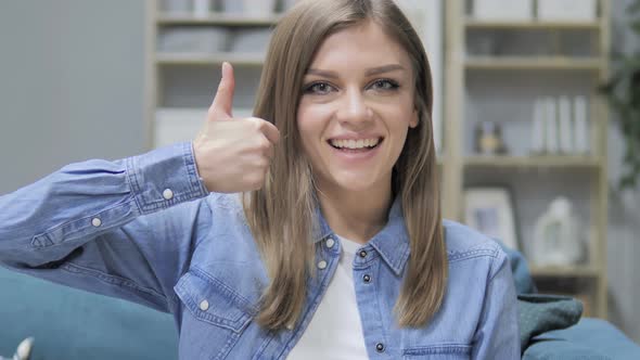 Thumbs Up By Young Girl in Creative Office