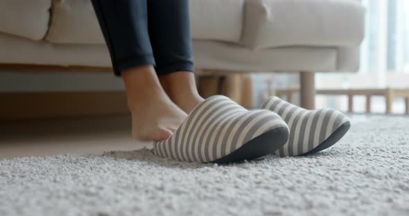 Woman wear slipper at home