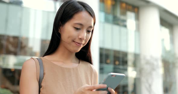 Woman Use of Mobile Phone in The City 