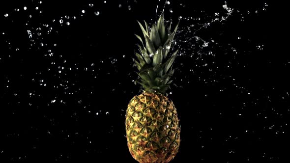 Super Slow Motion Fresh Rotating Pineapple with Water Droplets