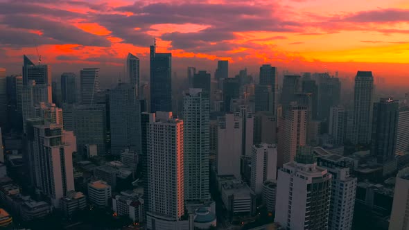 Beautiful Sunrise Above the High Rise Buildings in Manila City, Philippines. Aerial 