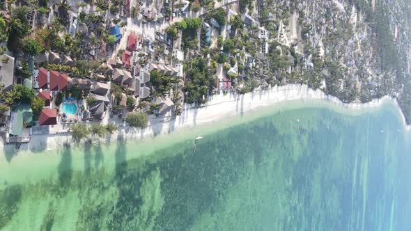 Vertical Video of the Ocean Near the Coast of Zanzibar Tanzania Aerial View