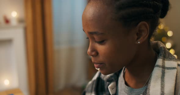 An Africanlooking Woman Wearing Plaid Shirt Has Video Chat and Communicates with Colleague alt