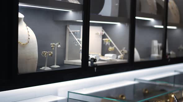 Jewellery on Shelves with Glass Indoors in Shop