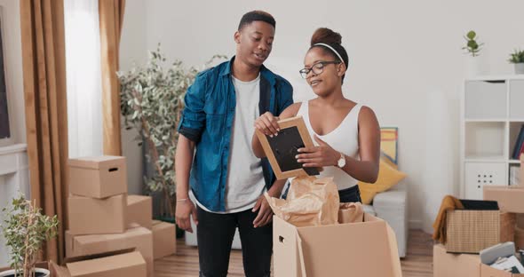 A Couple in Love Moves Into Their First Apartment of Their Own They Unpacking Boxes of Belongings