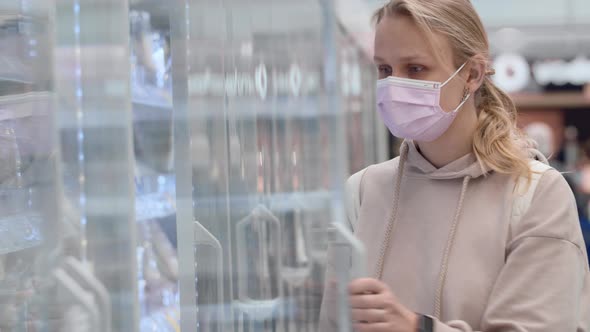 Woman in Mask Buying Yogurt in Supermarket