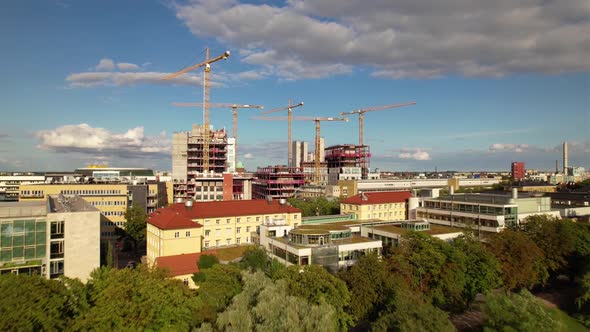 Flying forward upwards towards construction site in Malmö, Sweden