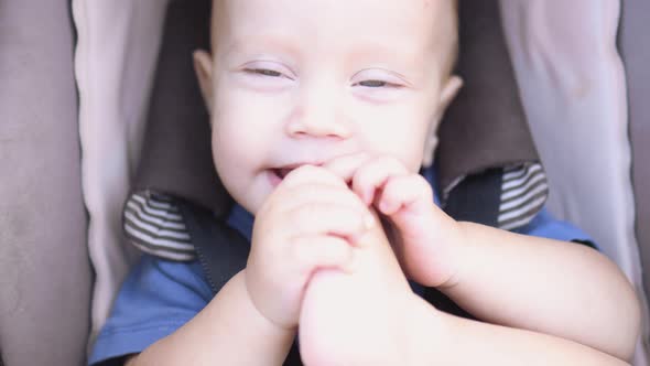 Closeup Portrait Caucasian Baby Infant Blue Eyes Sitting Brown Child Carriage