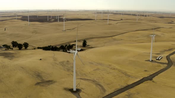 Aerial shot of Windmills in a lush green field on Montezuma Hills