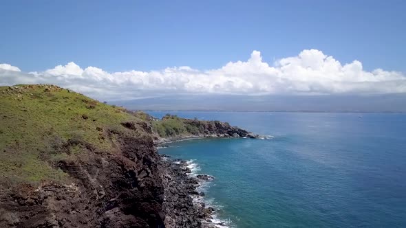 Tropical island coastline with cliffs and rocks