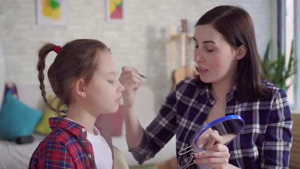 Close Up Mom Teaches Daughter To Use Cosmetics