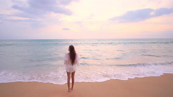 Asian woman enjoy around beautiful beach sea ocean