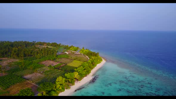 Aerial drone nature of perfect resort beach trip by blue green lagoon and white sand background of a