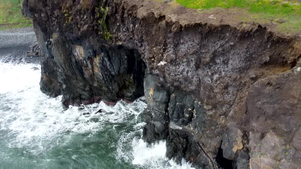 Aerial View of Rock and Foamy Sea at Madeira Portugal By Drone