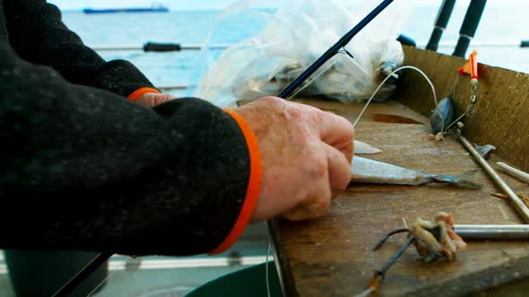 Fisherman filleting fish