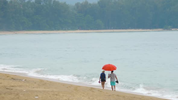 Couple Walking on the Beach