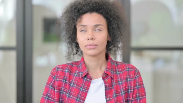 Portrait of Sleepy African Woman Yawning