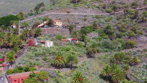 Masca town with roads and palms on a steep mountain cliff,Canary Islands,Spain.