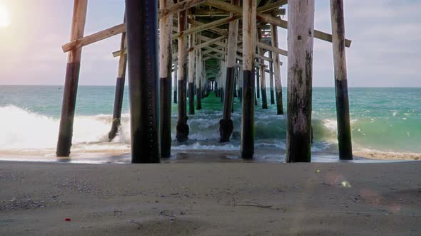 Time lapse of  waves under pier in New Port Beach, California