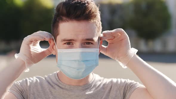 Closeup Shot of a Young Man Using a Medical Mask During the Covid19 Pandemic