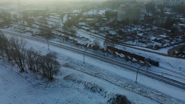 Flight over the city block. Winter cityscape.