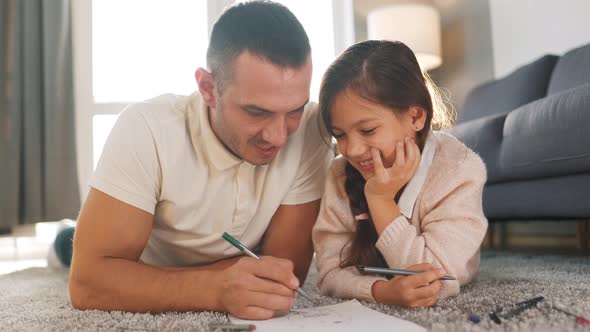 Father and Daughter Communicate Having Fun and Painting Together