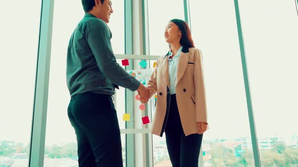 Business People Handshake in Corporate Office