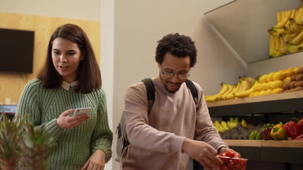 Multiracial Couple Choosing Products in Farm Store