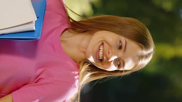 Vertical Screen Female Student Laughing in Park