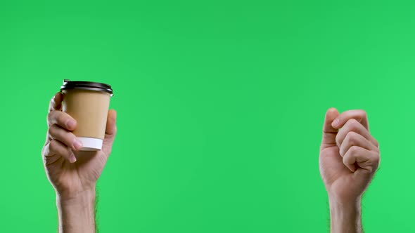 The Male Hand Points with the Index Finger to the Other Hand Holding a Paper Cup of Coffee Shows the