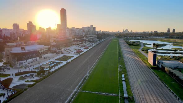Slow aerial dolly in shot along horse racing track at famous racecourse Hipodromo Argentino de Paler