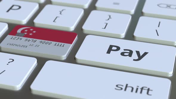 Bank Card Featuring Flag of Singapore As a Key on a Keyboard alt