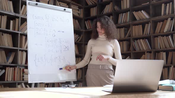 Hispanic Woman University Teacher Giving Online Math Class By Video Call