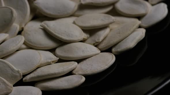 Cinematic, rotating shot of pumpking seeds - PUMPKIN SEEDS 033