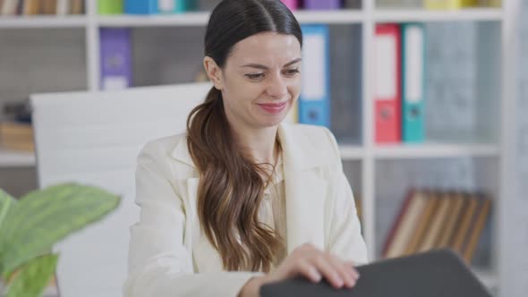 Stressed Young Woman Closing Laptop with Video Chat and Showing Tongue