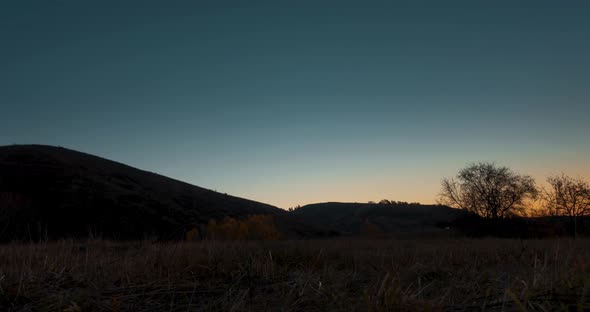 Mountain Meadow Timelapse at the Summer or Autumn Sunrise Time