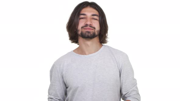 Goodlooking Longhaired Guy Showing Ok and Smiling Isolated Over White Background