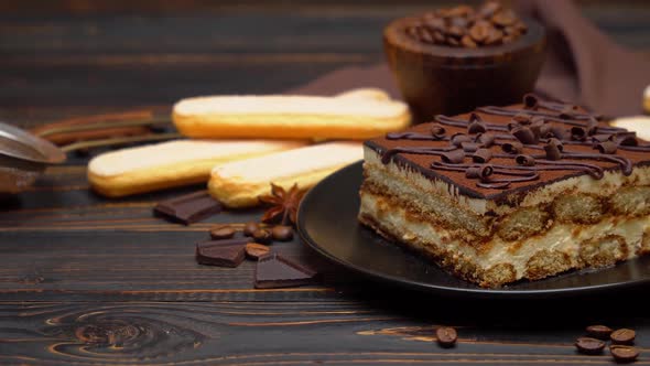 Portion of Traditional Italian Tiramisu Dessert Coffee Beans and Savoiardi Cookies