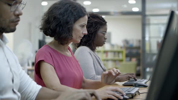 Thoughtful People Using Computers