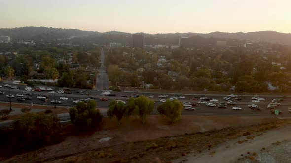 Aerial of busy traffic filled highways of the 101 and 405 in the San Fernando Valley of Los Angeles.