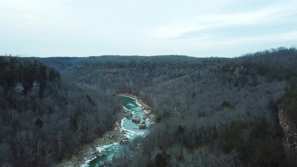Drone Over Icy Mountain River