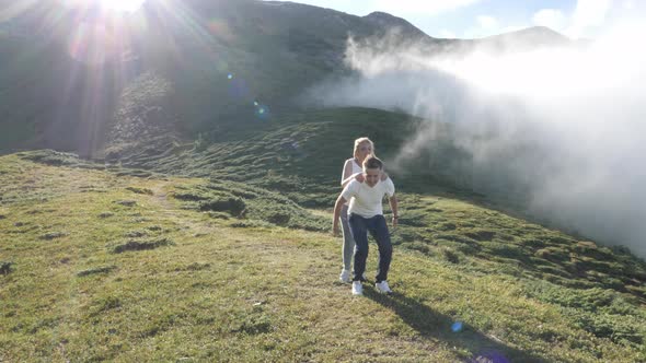 Girl jumping on boyfriend's back