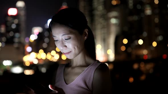 Woman Using Smart Phone at Night 