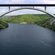 Aerial view of famous bridge over Krka river in Croatia, Europe. Drone flying under the bridge - VideoHive Item for Sale