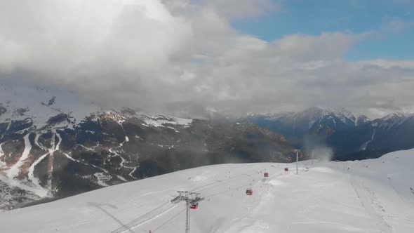 Aerial View Snow Covered Mountains and Ski Resort.