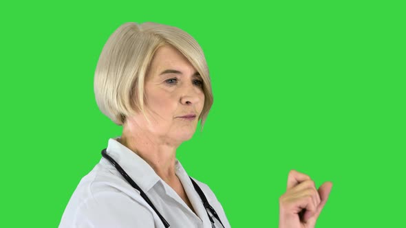 Healthcare Medicine and Technology Concept Senior Female Doctor Pointing To Something or Pressing