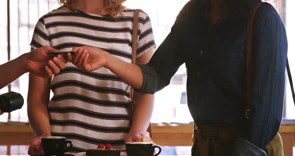 Customer making payment through payment terminal