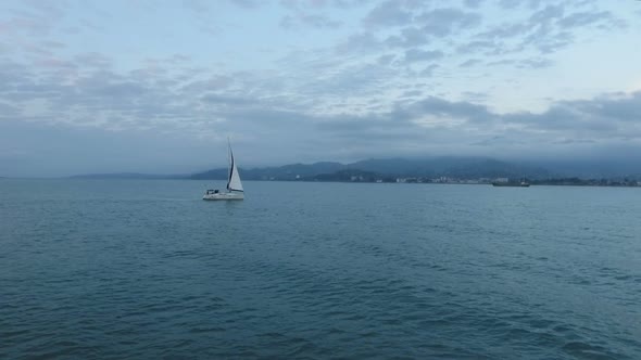 Romantic Voyage on Sailing Boat, Wind Carrying Vessel Into Bright Cloudscape