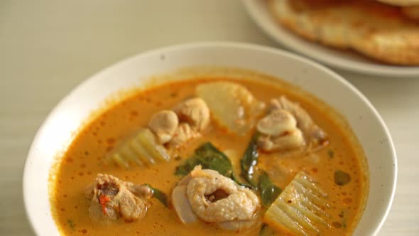 Chicken curry soup with roti or naan with chicken tikka masala - Asian food style